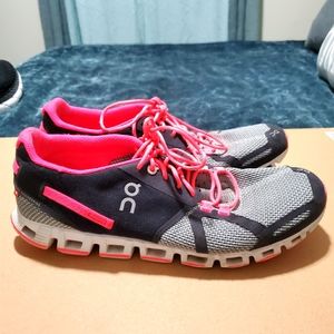 On grey, black, and pink running shoe
